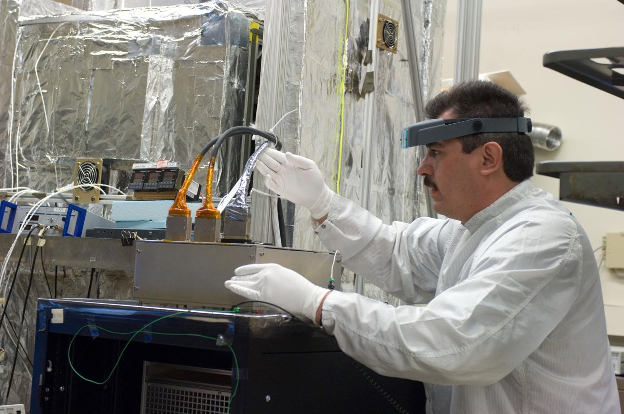 Kepler project; technicians from Ball Aerospace work on  and in the test chamber assembled at Nasa Ames Research center testing components