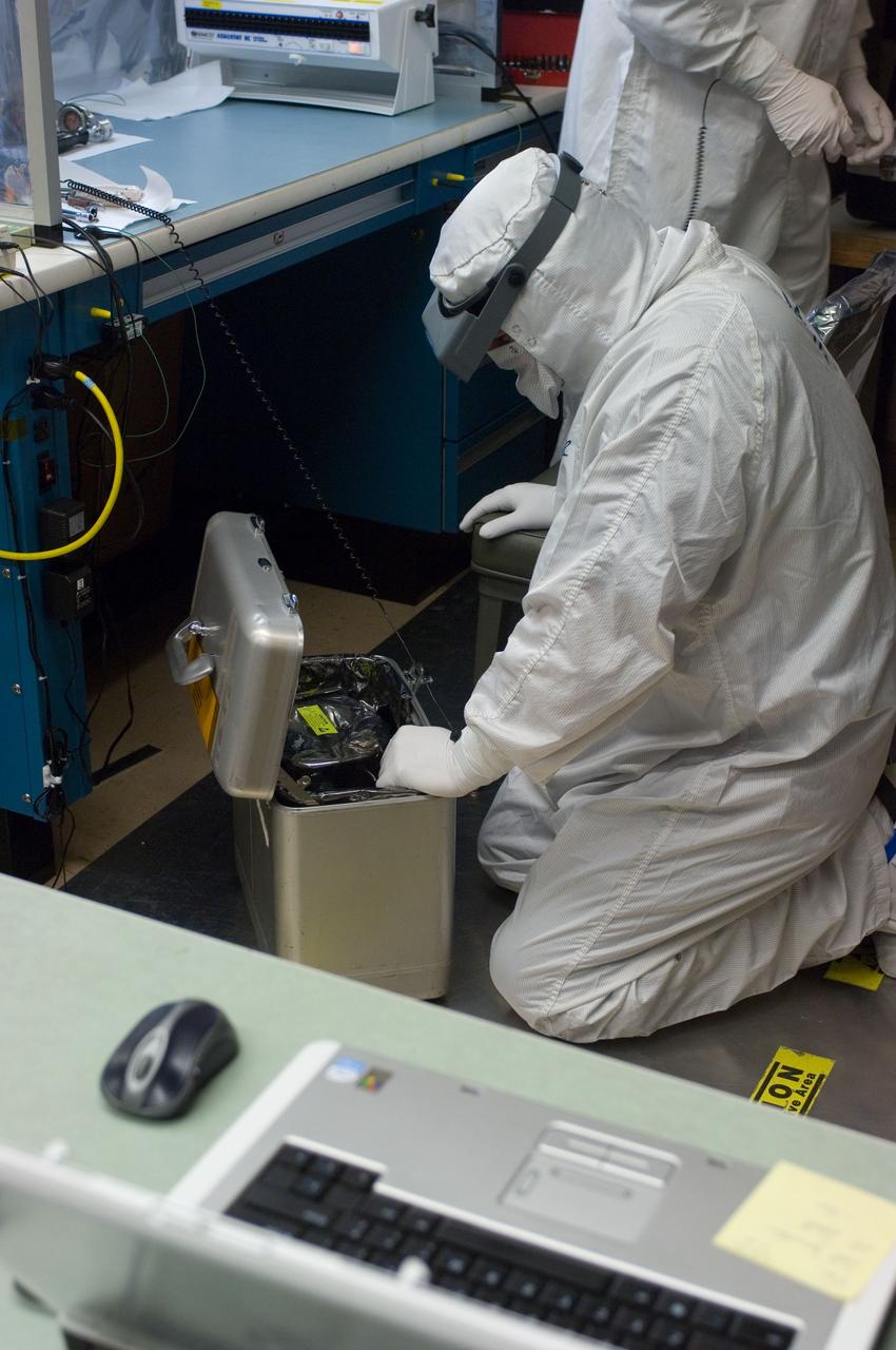 Kepler project; technicians from Ball Aerospace work on  and in the test chamber assembled at Nasa Ames Research center testing components