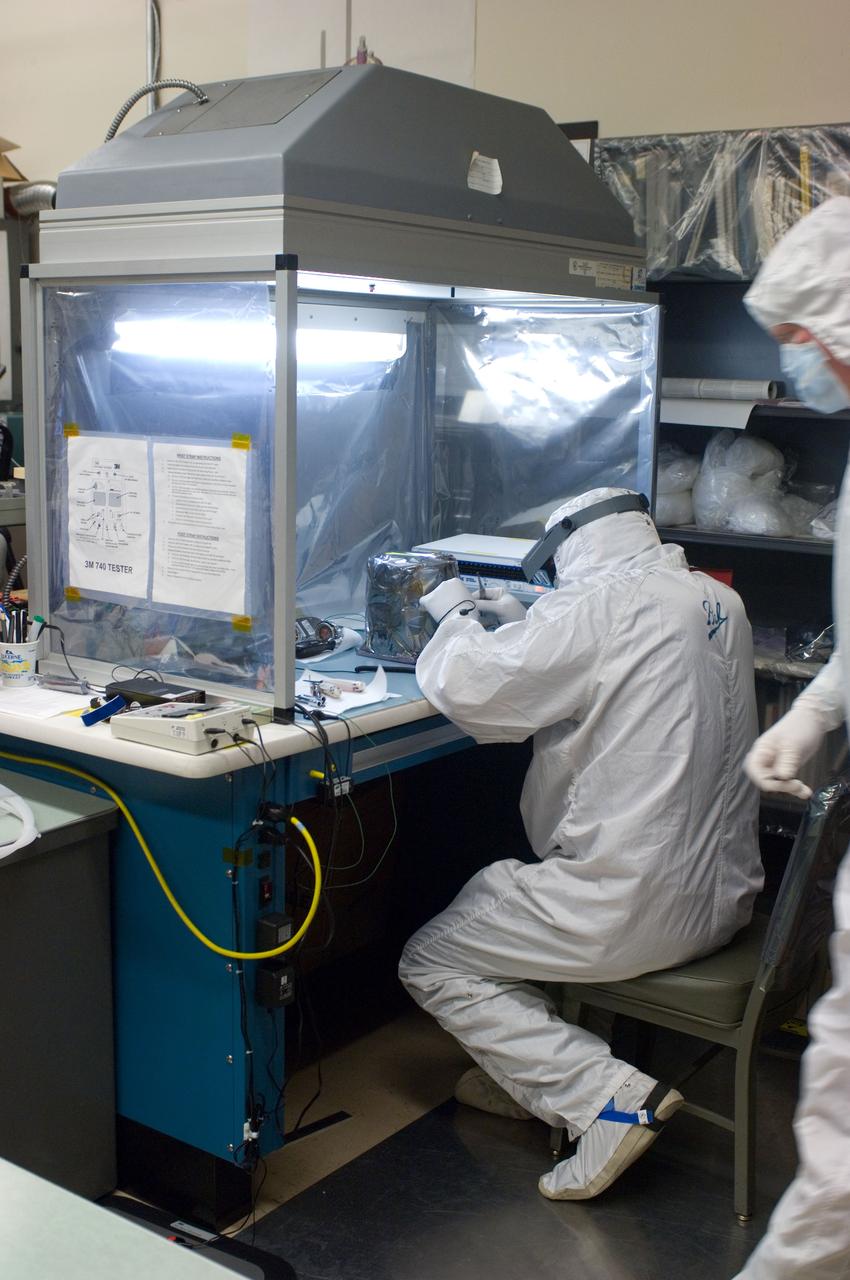 Kepler project; technicians from Ball Aerospace work on  and in the test chamber assembled at Nasa Ames Research center testing components