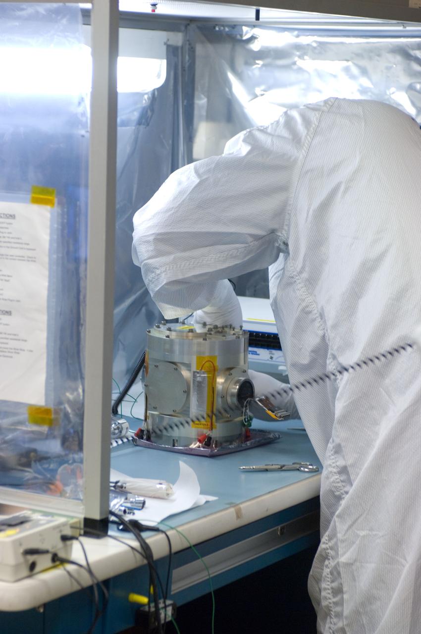 Kepler project; technicians from Ball Aerospace work on  and in the test chamber assembled at Nasa Ames Research center testing components