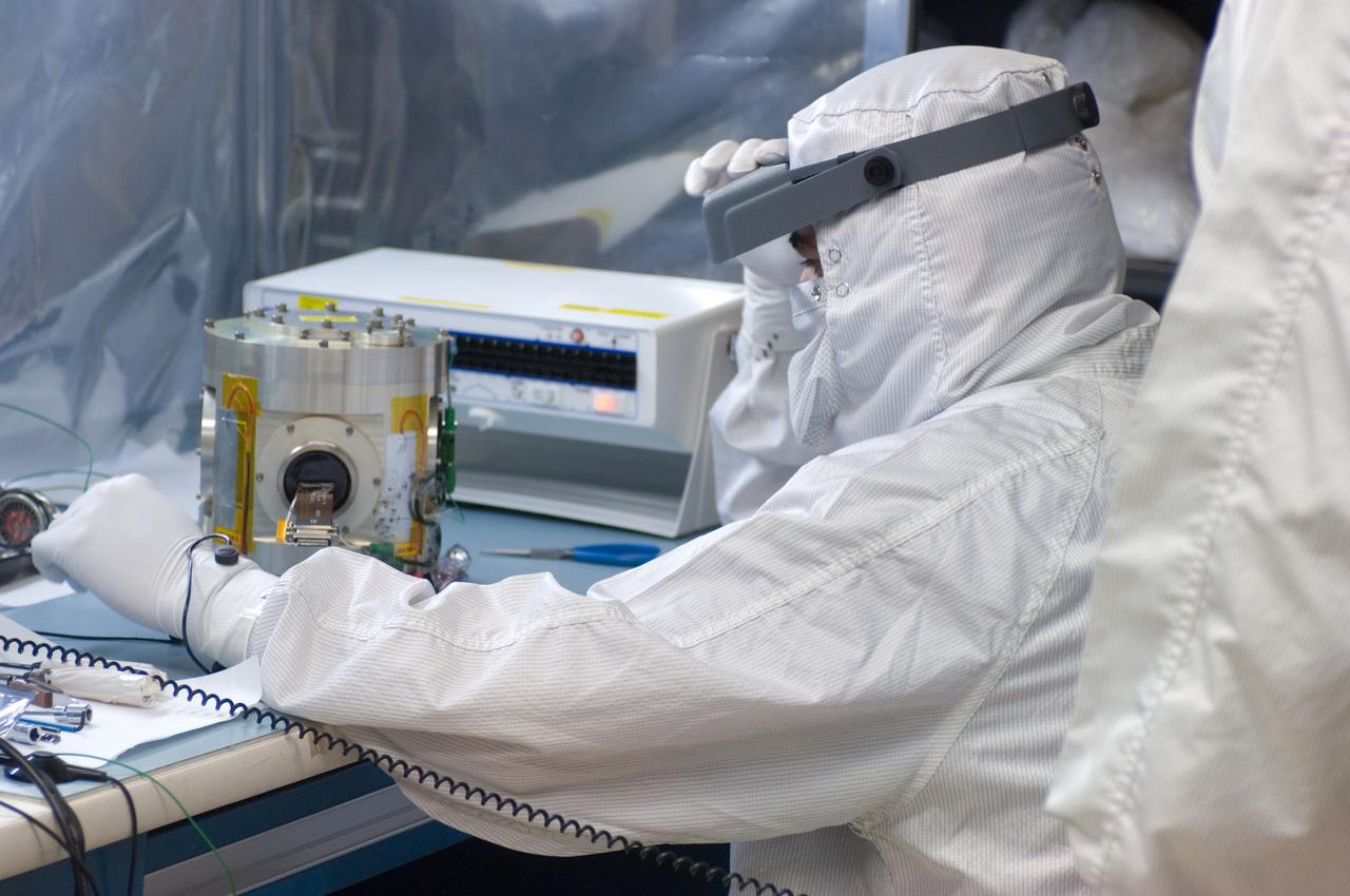 Kepler project; technicians from Ball Aerospace work on  and in the test chamber assembled at Nasa Ames Research center testing components
