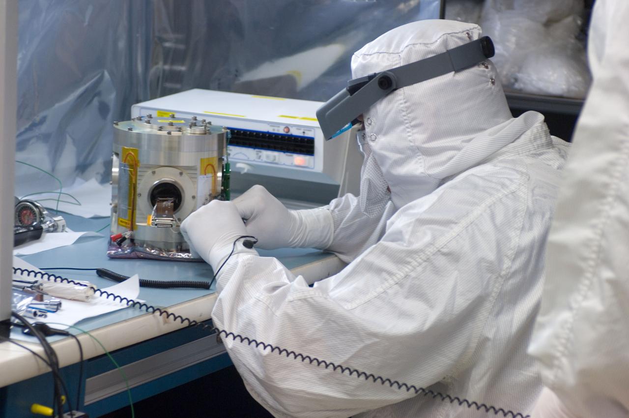 Kepler project; technicians from Ball Aerospace work on  and in the test chamber assembled at Nasa Ames Research center testing components