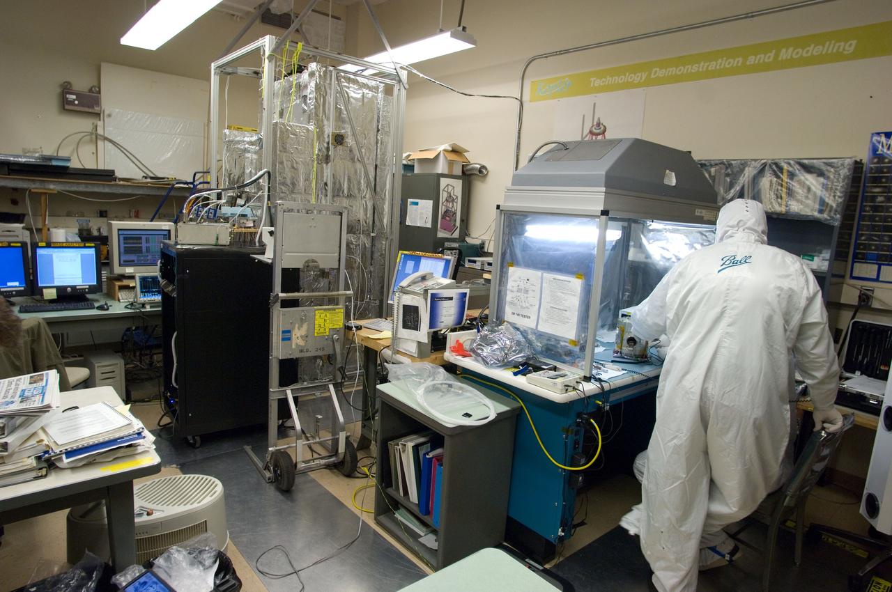Kepler project; technicians from Ball Aerospace work on and in the test chamber assembled at Nasa Ames Research center testing components