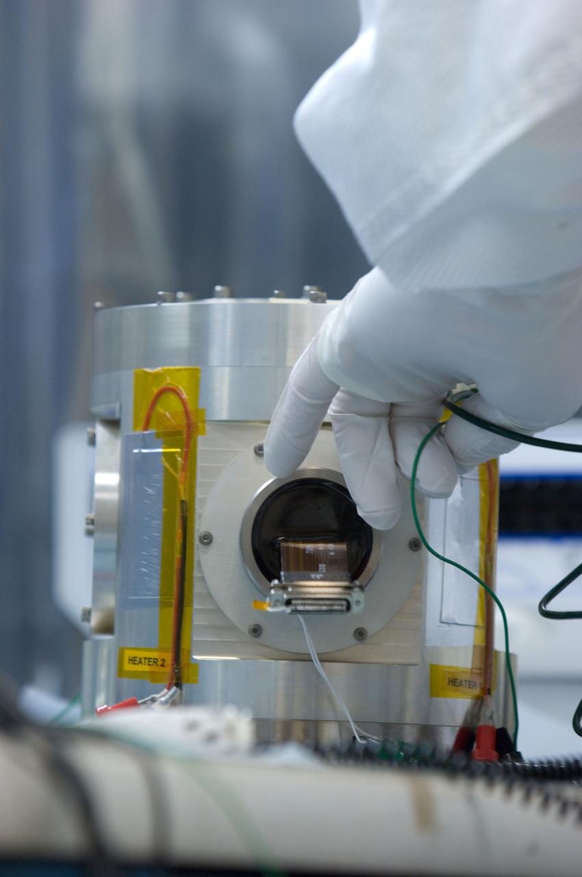 Kepler project; technicians from Ball Aerospace work on  and in the test chamber assembled at Nasa Ames Research center testing components