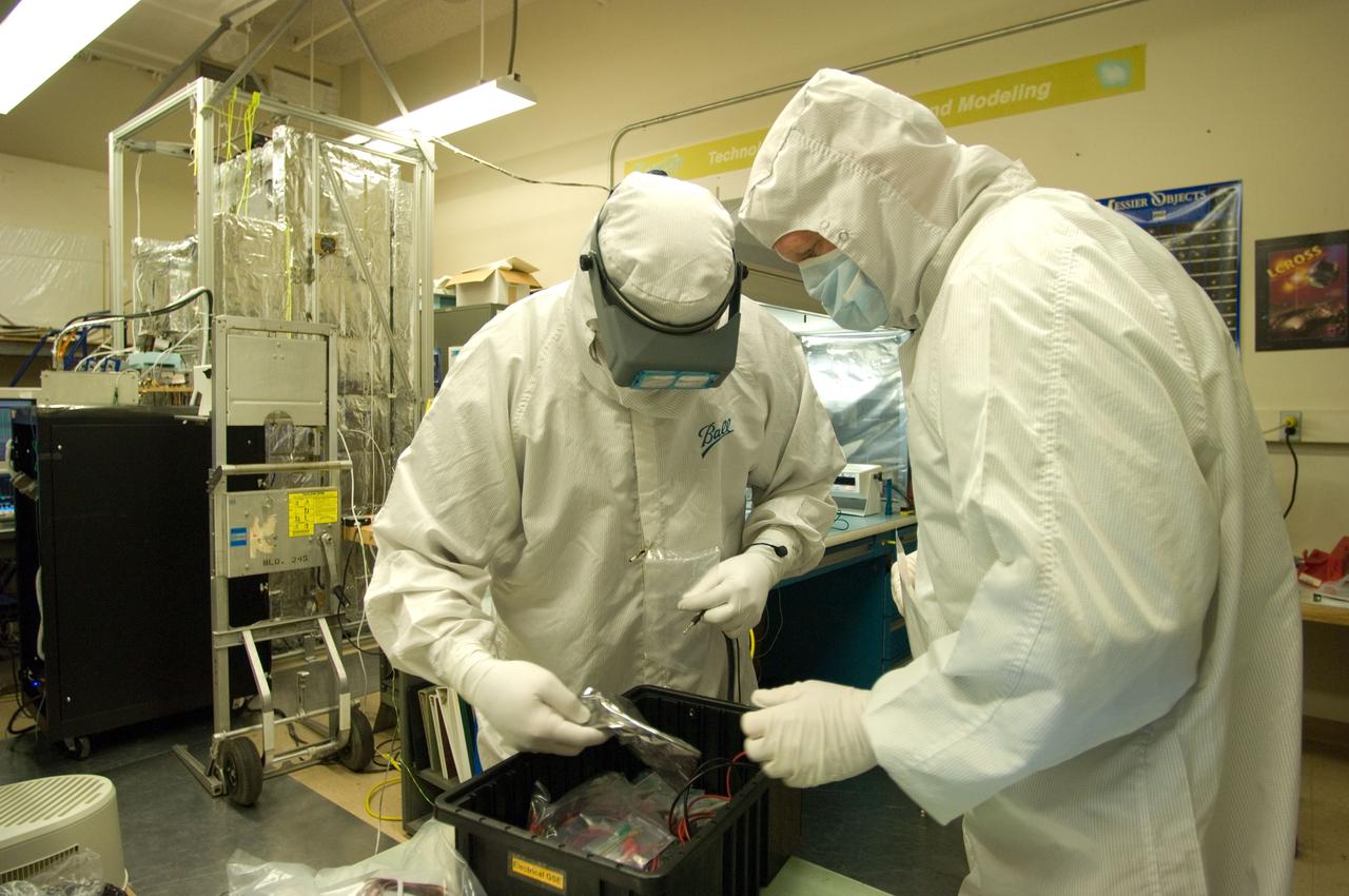 Kepler project; technicians from Ball Aerospace work on  and in the test chamber assembled at Nasa Ames Research center testing components