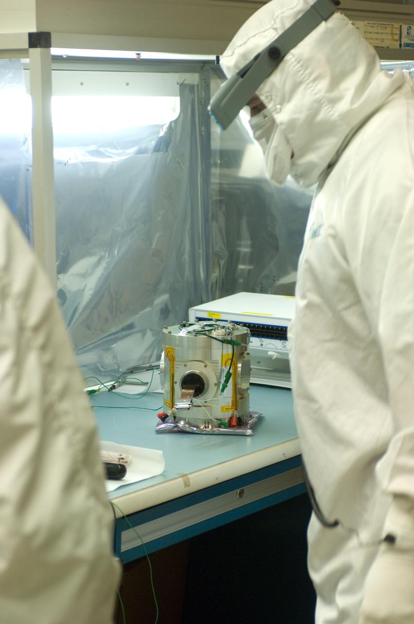 Kepler project; technicians from Ball Aerospace work on  and in the test chamber assembled at Nasa Ames Research center testing components