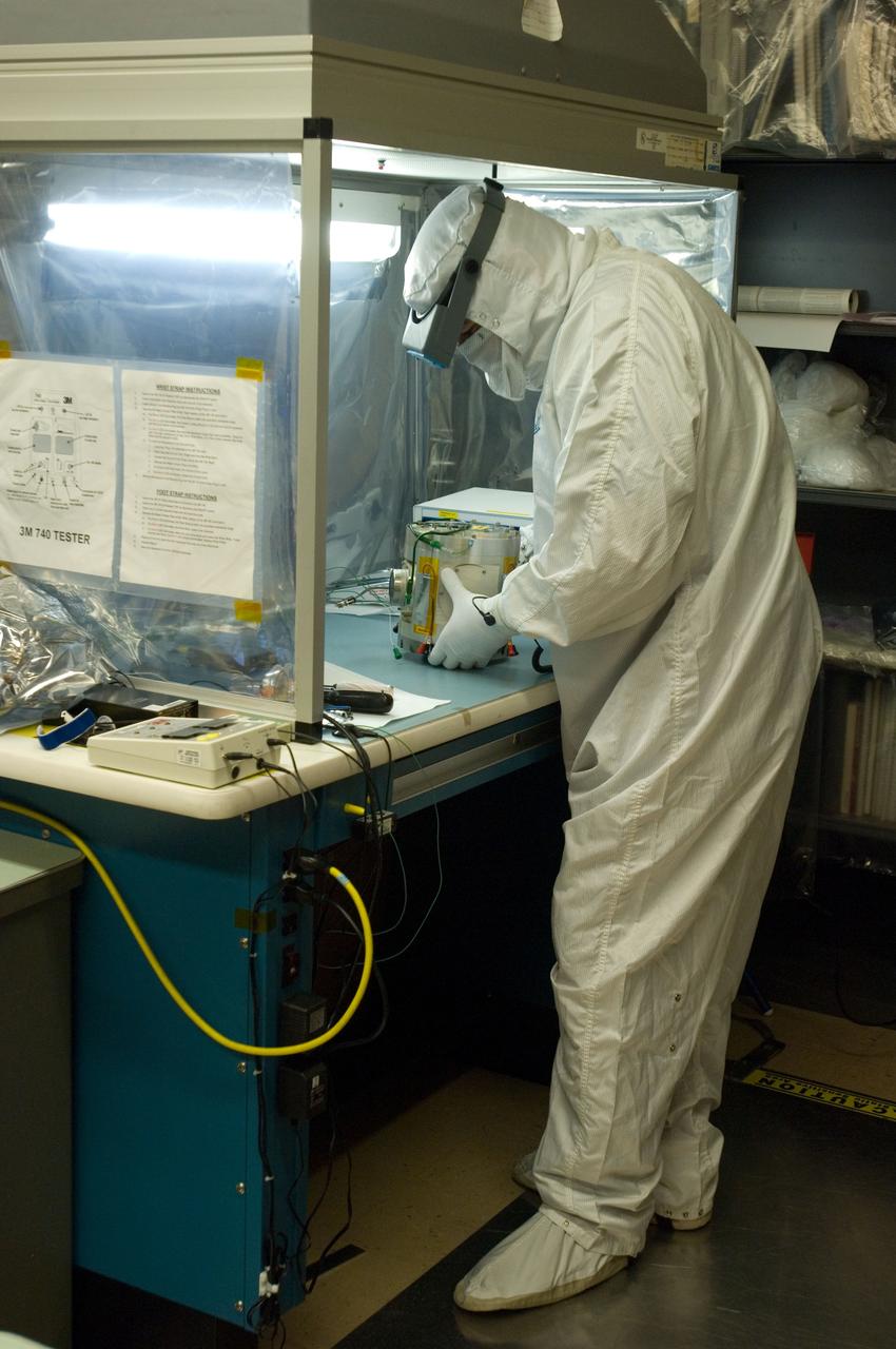 Kepler project; technicians from Ball Aerospace work on  and in the test chamber assembled at Nasa Ames Research center testing components