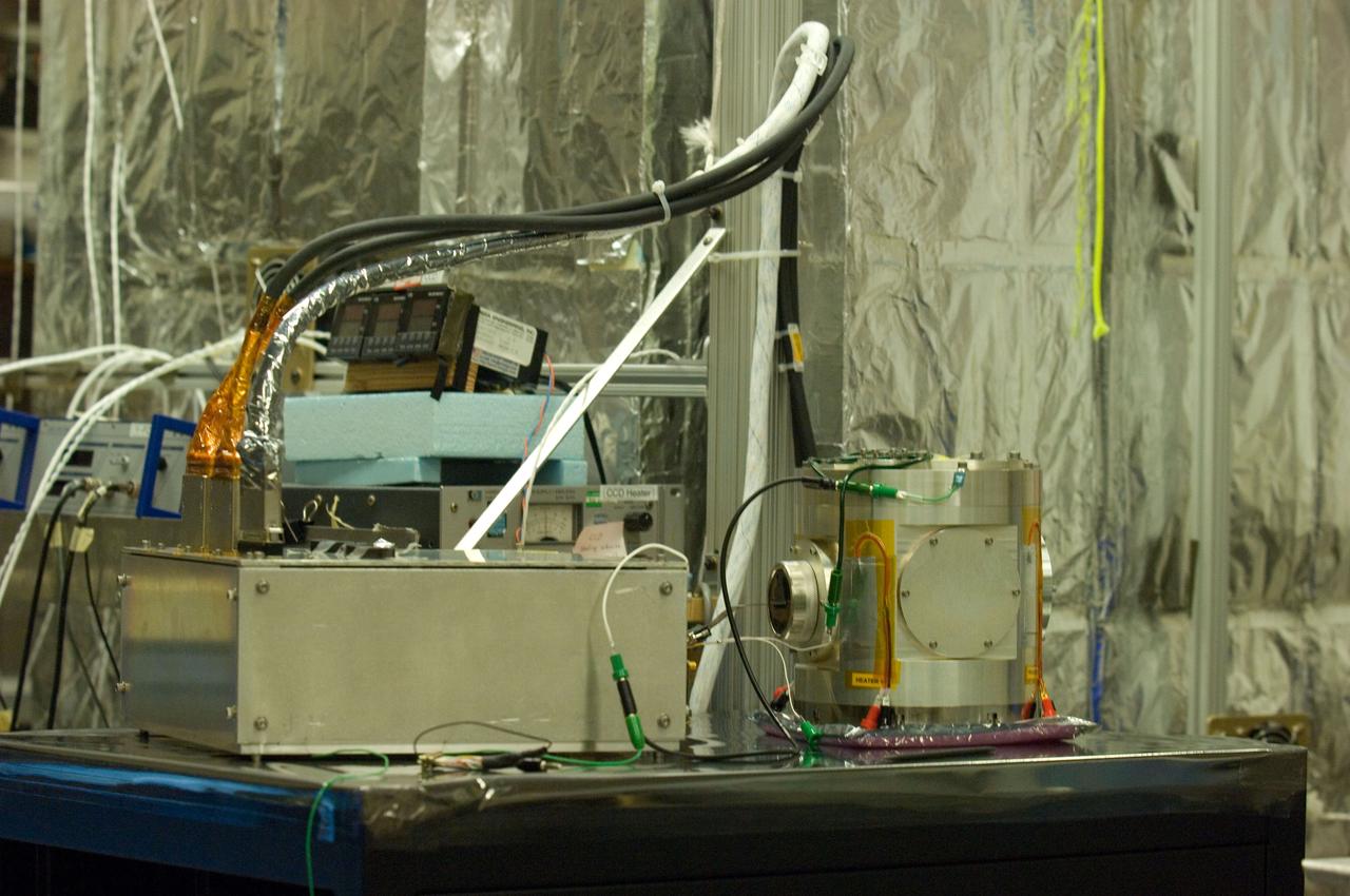 Kepler project; technicians from Ball Aerospace work on  and in the test chamber assembled at Nasa Ames Research center testing components