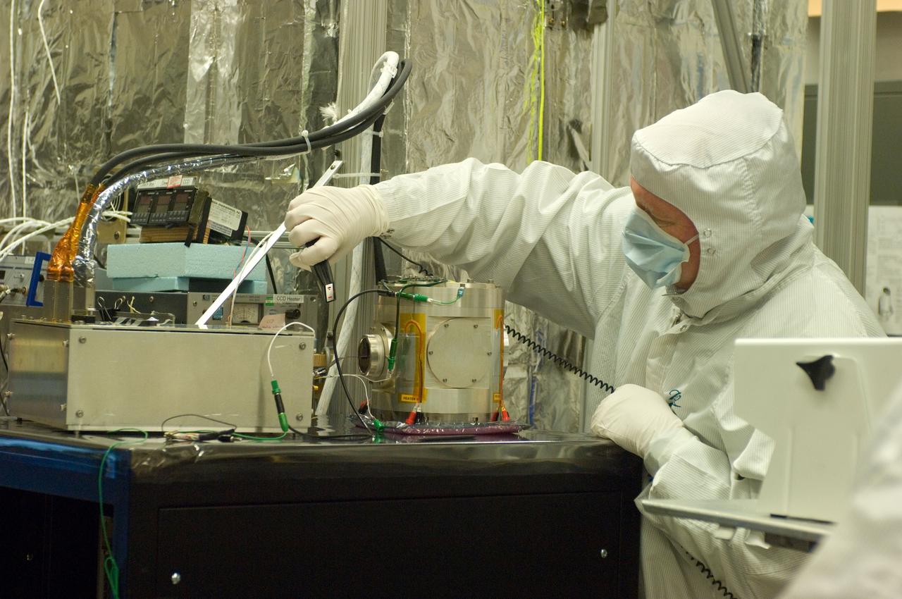 Kepler project; technicians from Ball Aerospace work on  and in the test chamber assembled at Nasa Ames Research center testing components