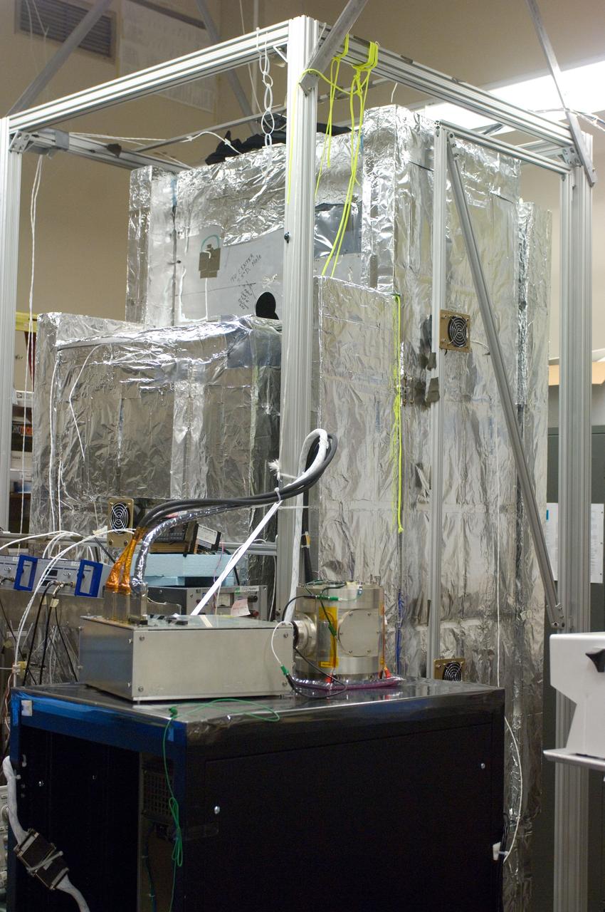 Kepler project; technicians from Ball Aerospace work on  and in the test chamber assembled at Nasa Ames Research center testing components