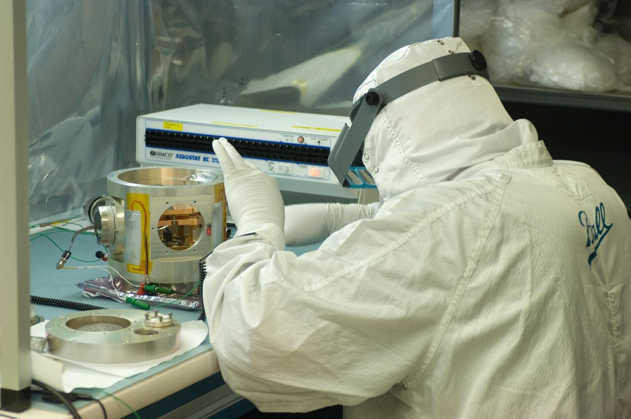 Kepler project; technicians from Ball Aerospace work on  and in the test chamber assembled at Nasa Ames Research center testing components