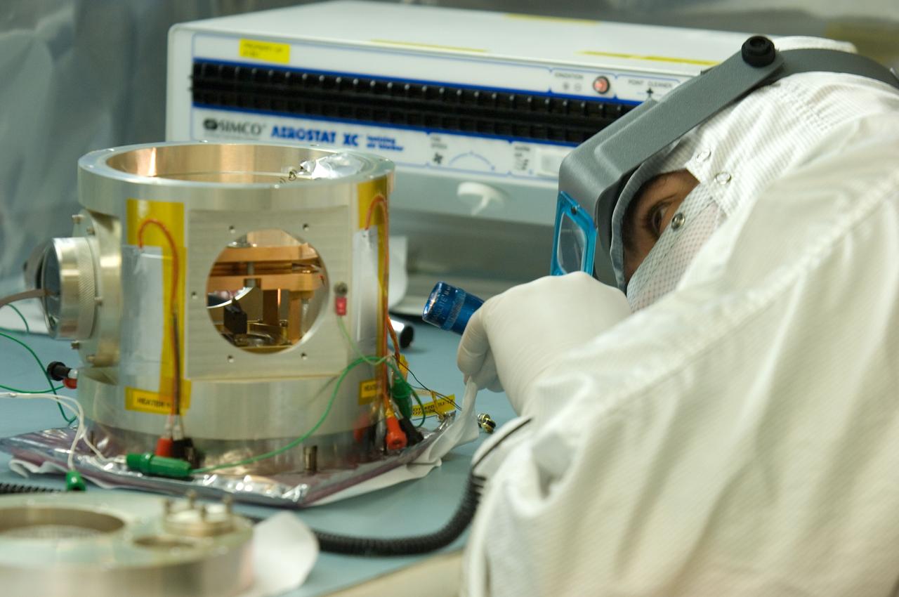 Kepler project; technicians from Ball Aerospace work on  and in the test chamber assembled at Nasa Ames Research center testing components