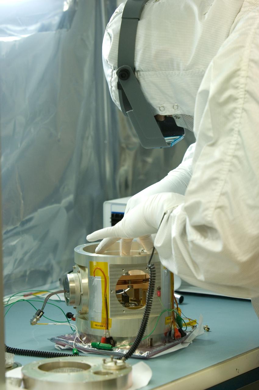 Kepler project; technicians from Ball Aerospace work on  and in the test chamber assembled at Nasa Ames Research center testing components