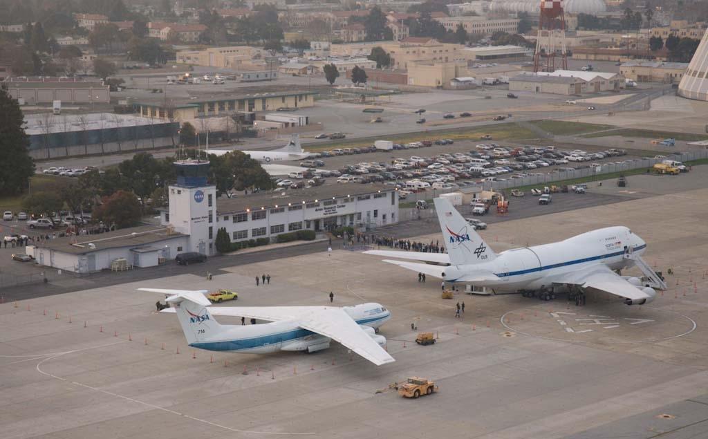 SOFIA visit to Ames: overheads of event of SOFIA (fStratospheric Observatory for Infrared Astronomy) on Moffett Federal Airfield tarmac with the KAO (Kaiper Airborne Obervatory) parked behind for comparison during the tour event for Ames & NASA Research Park staff.
