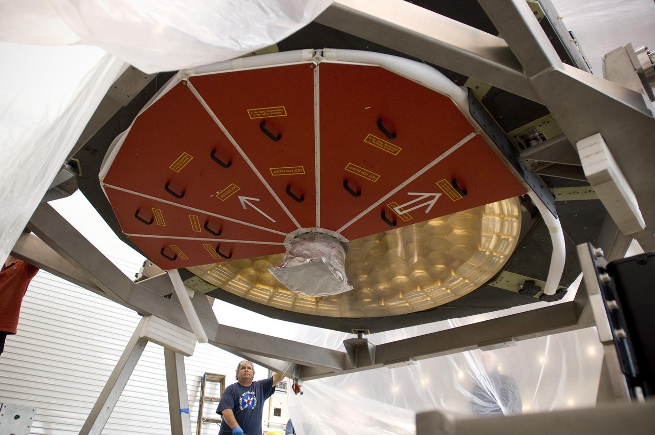 SOFIA (Stratospheric Observatory for Infrared Astronomy) primary mirror being moved into N-211, readied and move into the Ames Vacuum Chamber for the coating process.
