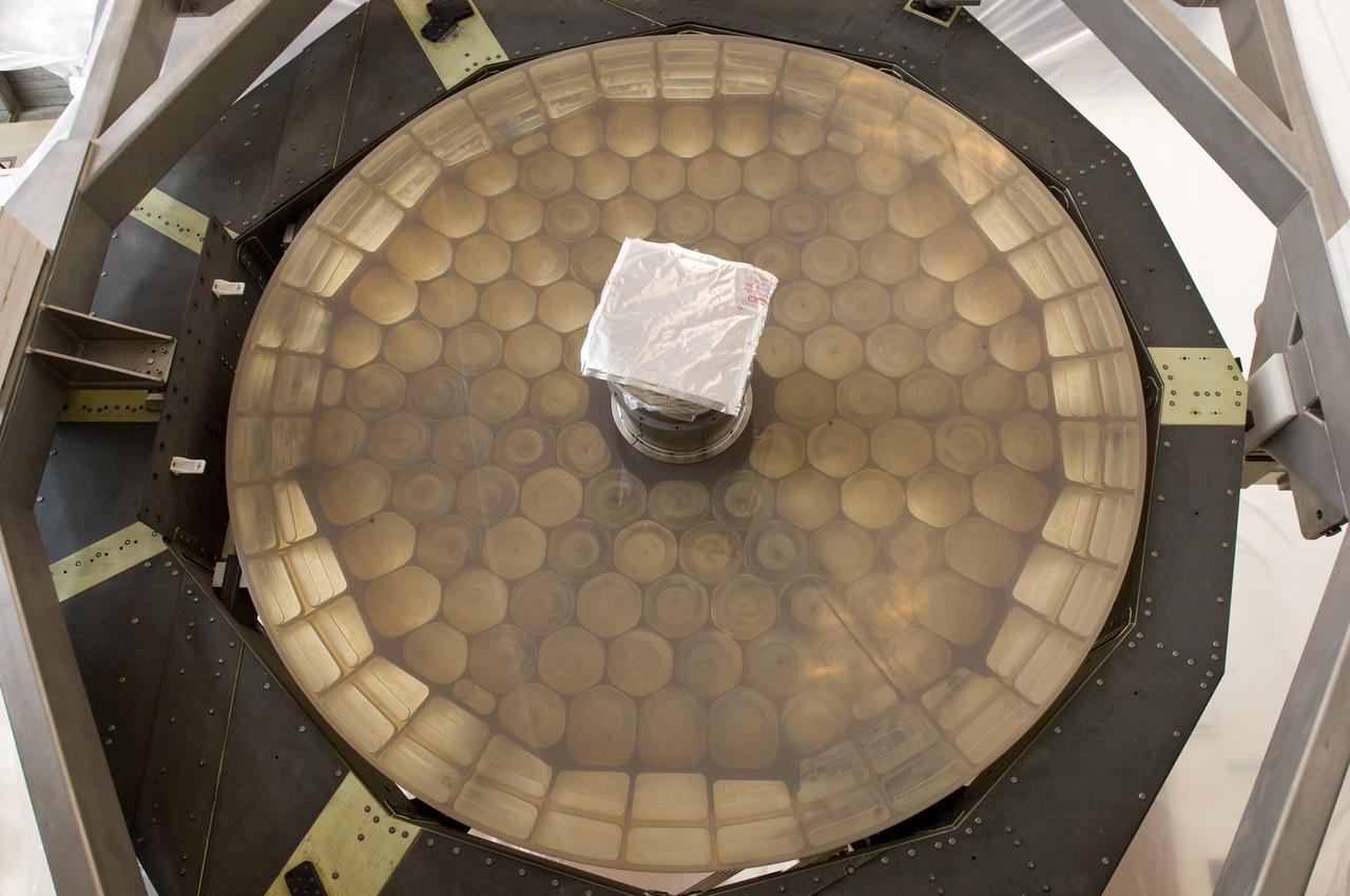 SOFIA (Stratospheric Observatory for Infrared Astronomy) primary mirror being moved into N-211, readied and move into the Ames Vacuum Chamber for the coating process.