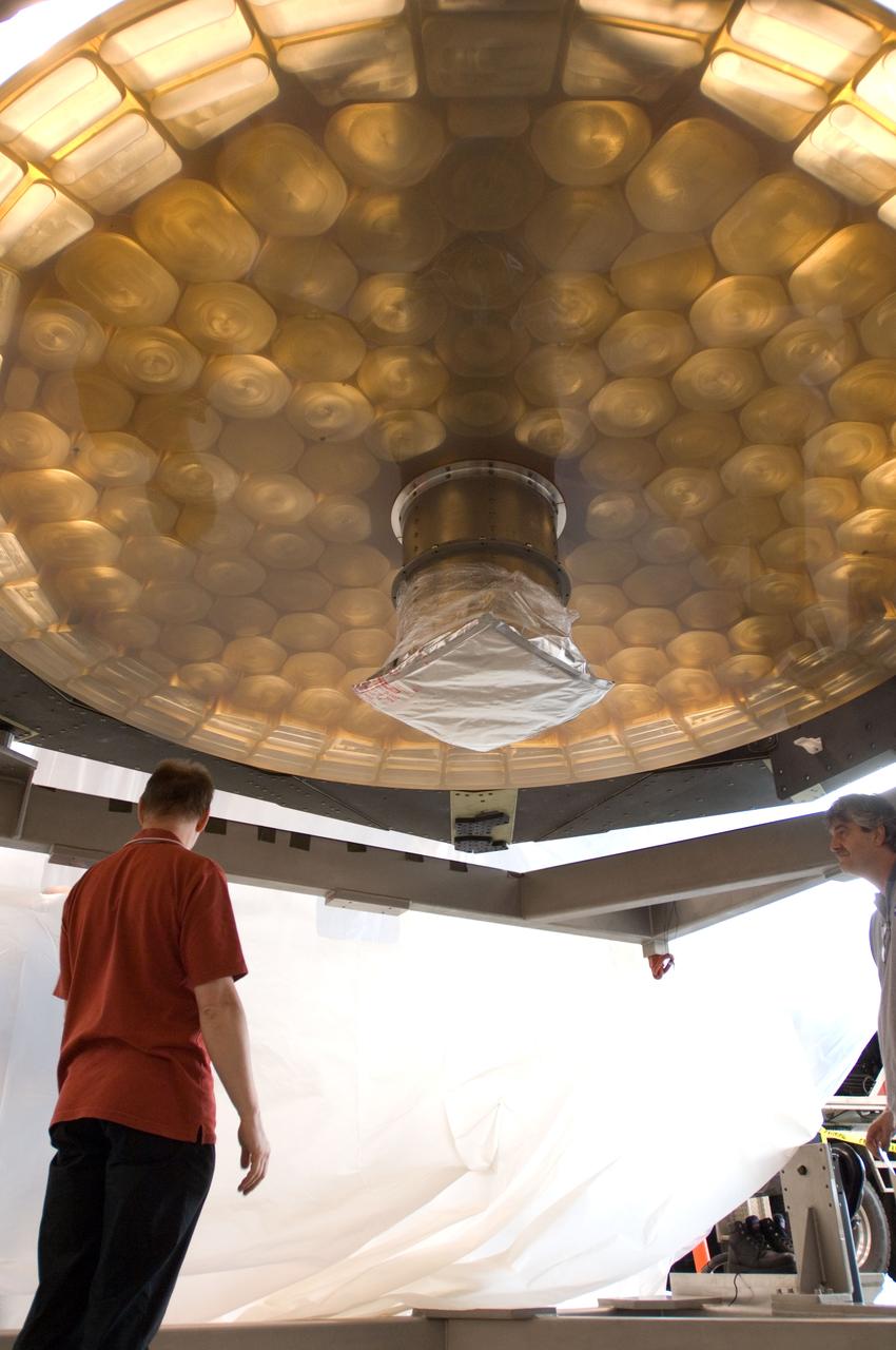 SOFIA (Stratospheric Observatory for Infrared Astronomy) primary mirror being moved into N-211, readied and move into the Ames Vacuum Chamber for the coating process.