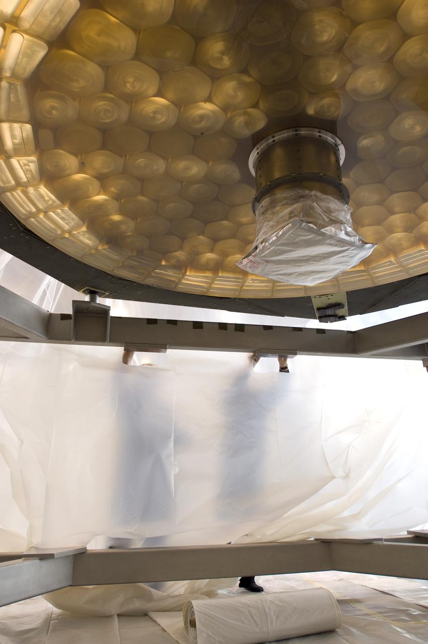 SOFIA (Stratospheric Observatory for Infrared Astronomy) primary mirror being moved into N-211, readied and move into the Ames Vacuum Chamber for the coating process.