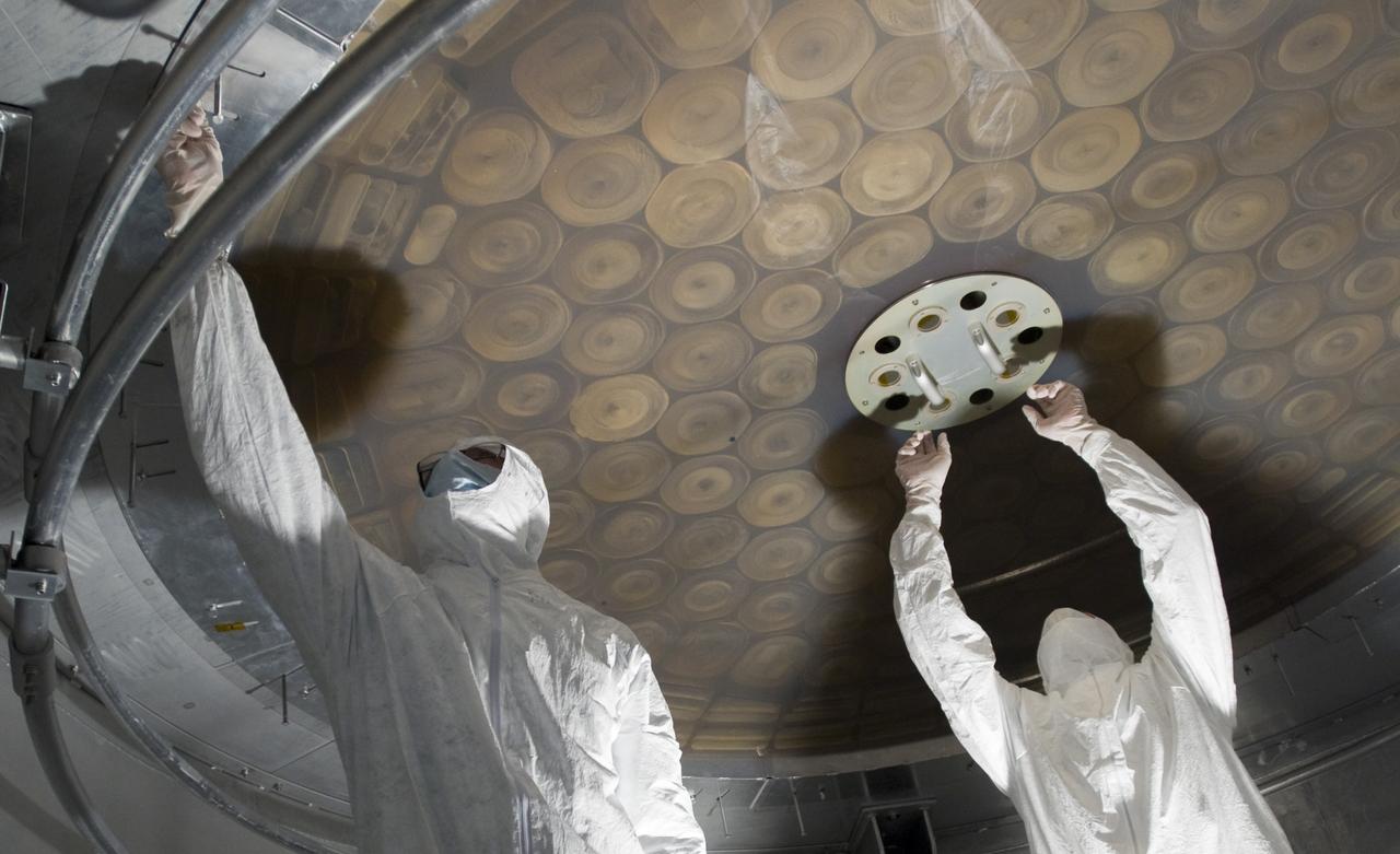 SOFIA (Stratospheric Observatory for Infrared Astronomy) primary mirror being coated in the Ames N-211 Vacuum Chamber.