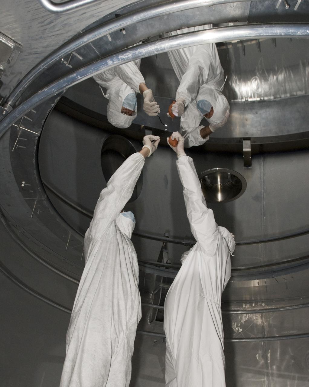 SOFIA (Stratospheric Observatory for Infrared Astronomy) primary mirror being coated in the Ames N-211 Vacuum Chamber.