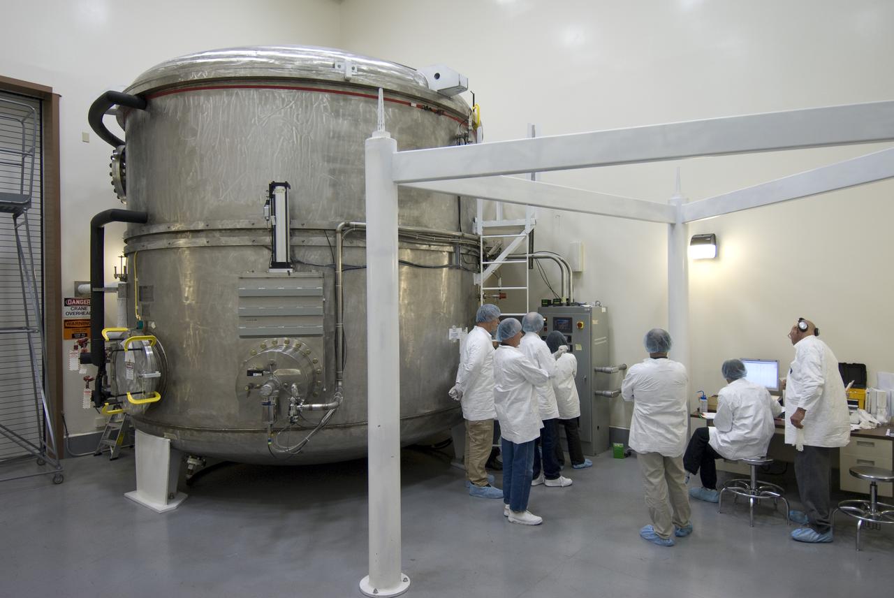 SOFIA (Stratospheric Observatory for Infrared Astronomy) primary mirror being coated in the Ames N-211 Vacuum Chamber.