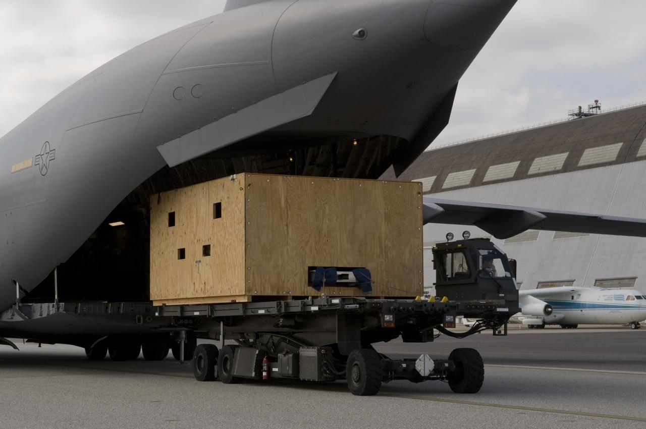 SOFIA (Stratospheric Observatory for Infrared Astromony)  primary mirror coating completed at the Ames Vacuum Chamber in N-211 is being loaded on to a C-17 for the return trip to Dryden Flgiht Research Center