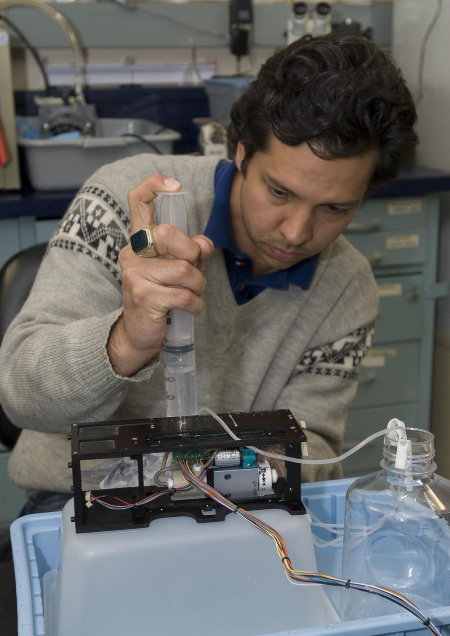 Pre-Sat/Pharmasat practice/backup box Matt Piecini calibrating fluidic in lab