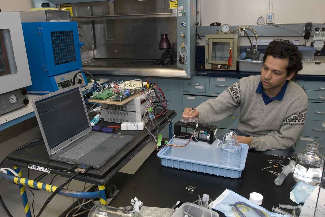 Pre-Sat/Pharmasat practice/backup box Matt Piecini calibrating fluidic in lab