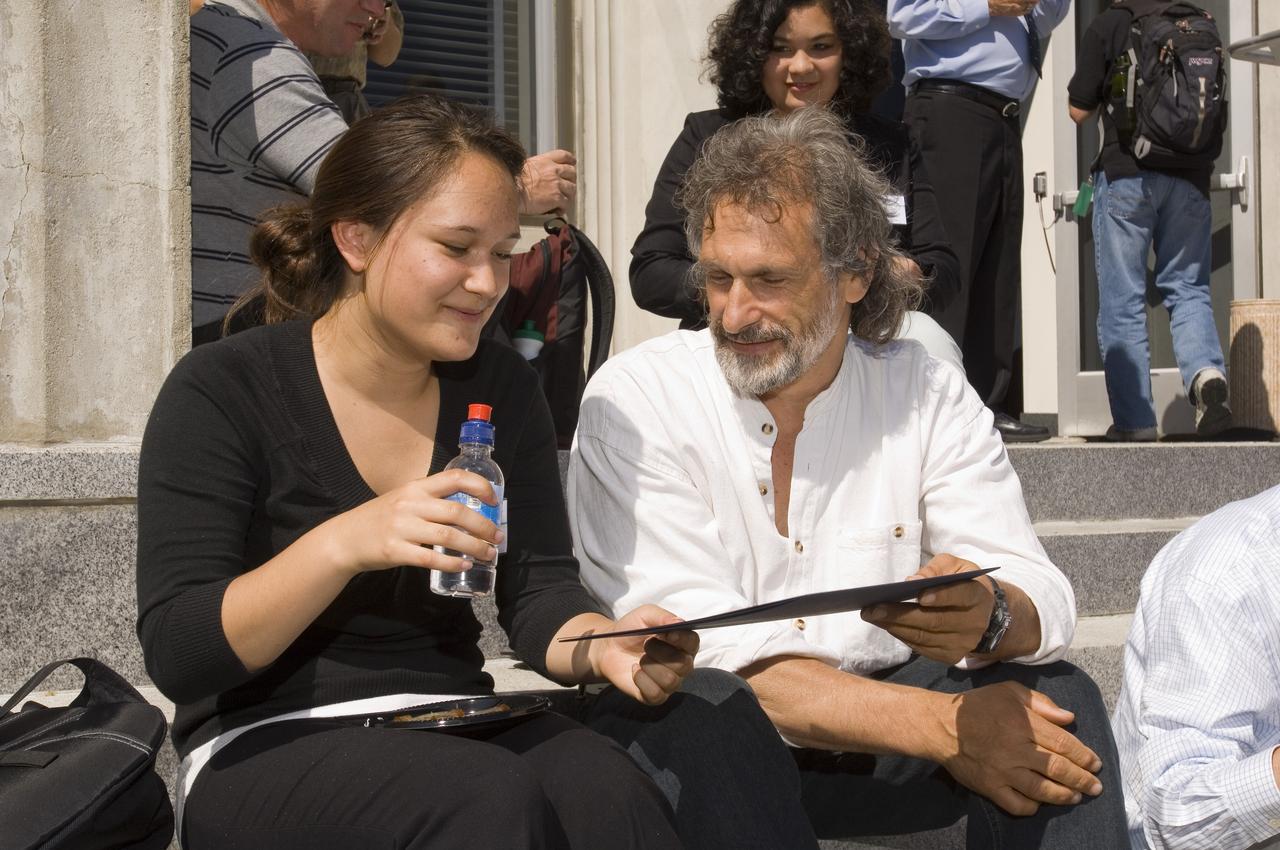 Summer Internship for 2008 closing ceremony: student with mentor Jonathan Trent on steps of the Ames Administration building N-200 enjoying the reception.