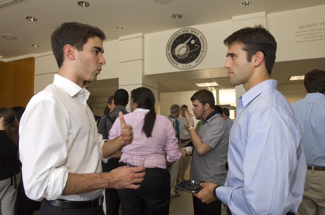 Summer Internship for 2008 closing ceremony  students enjoying the receptionon in lobby of the Ames Administration building N-200.