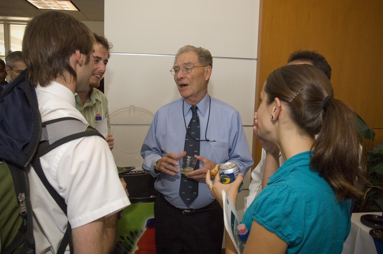 Summer Internship for 2008 closing ceremony  students enjoying the receptionon in lobby of the Ames Administration building N-200.