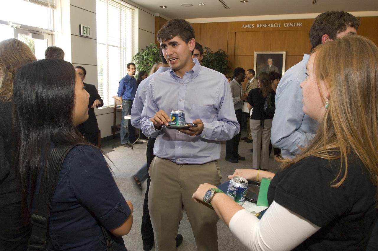 Summer Internship for 2008 closing ceremony  students enjoying the receptionon in lobby of the Ames Administration building N-200.