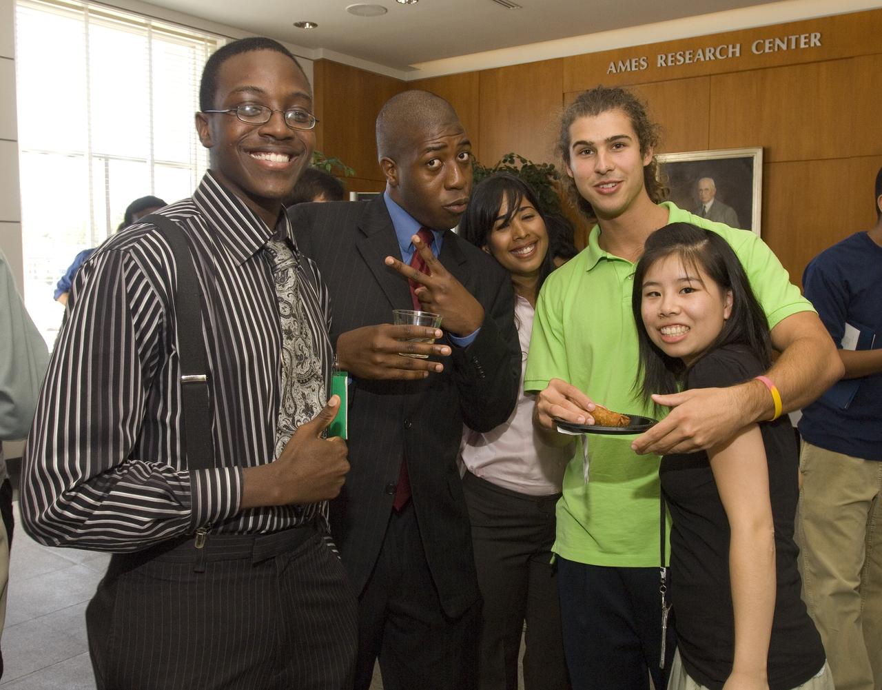 Summer Internship for 2008 closing ceremony  students enjoying the receptionon in lobby of the Ames Administration building N-200.
