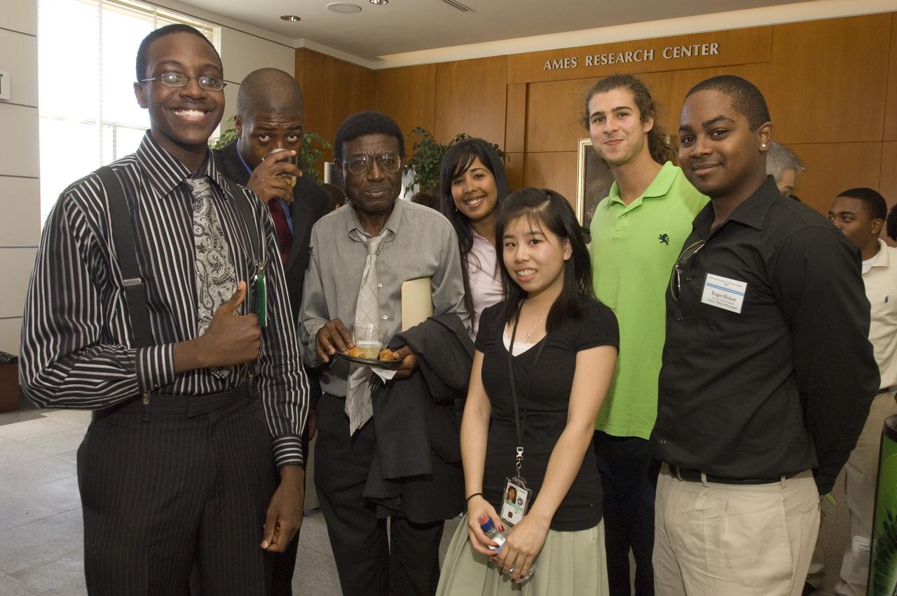 Summer Internship for 2008 closing ceremony  students enjoying the receptionon in lobby of the Ames Administration building N-200.