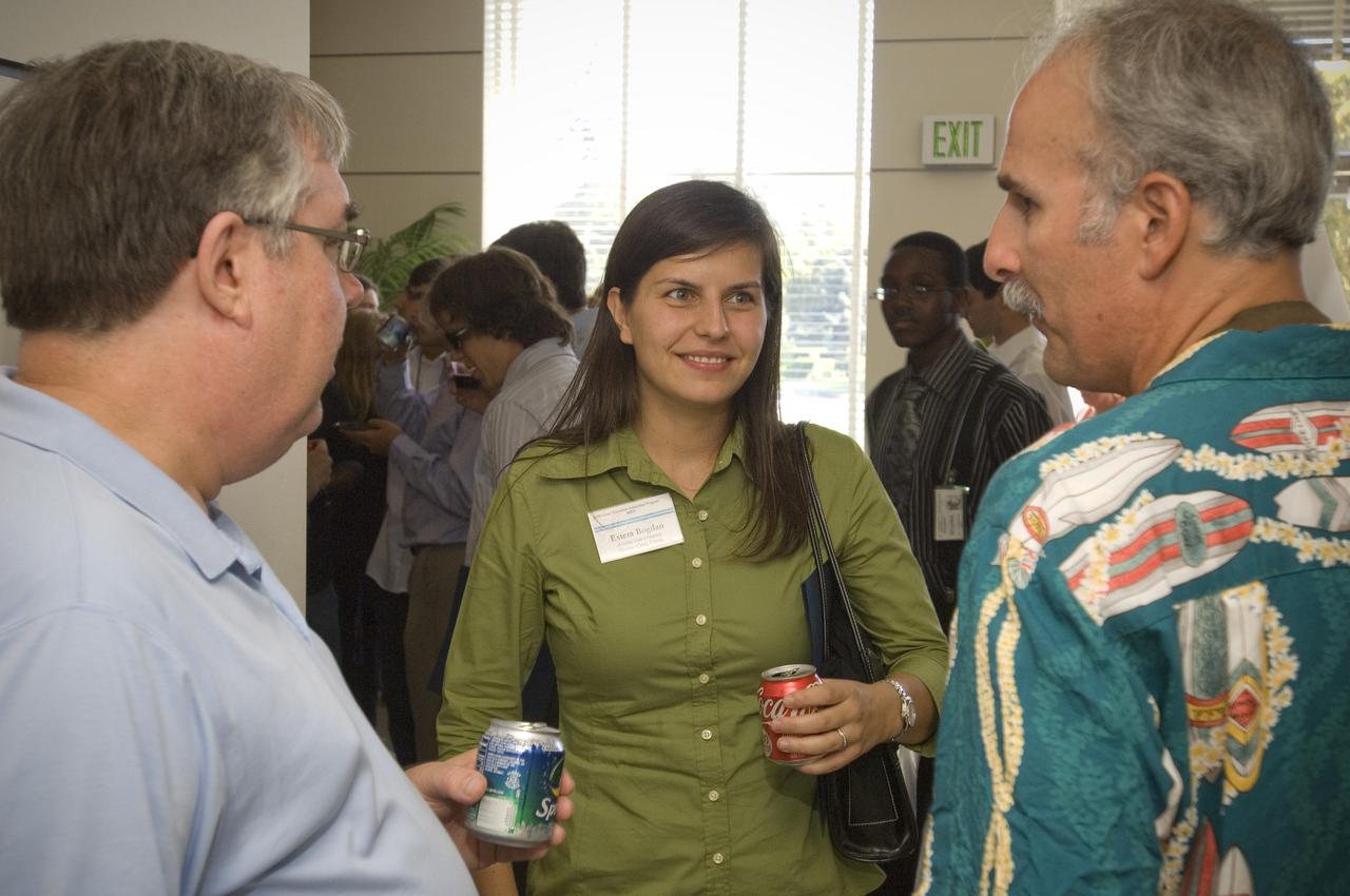 Summer Internship for 2008 closing ceremony  students enjoying the receptionon in lobby of the Ames Administration building N-200.