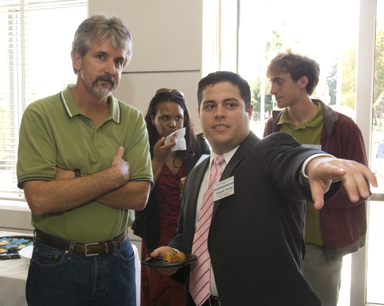 Summer Internship for 2008 closing ceremony  students enjoying the receptionon in lobby of the Ames Administration building N-200.