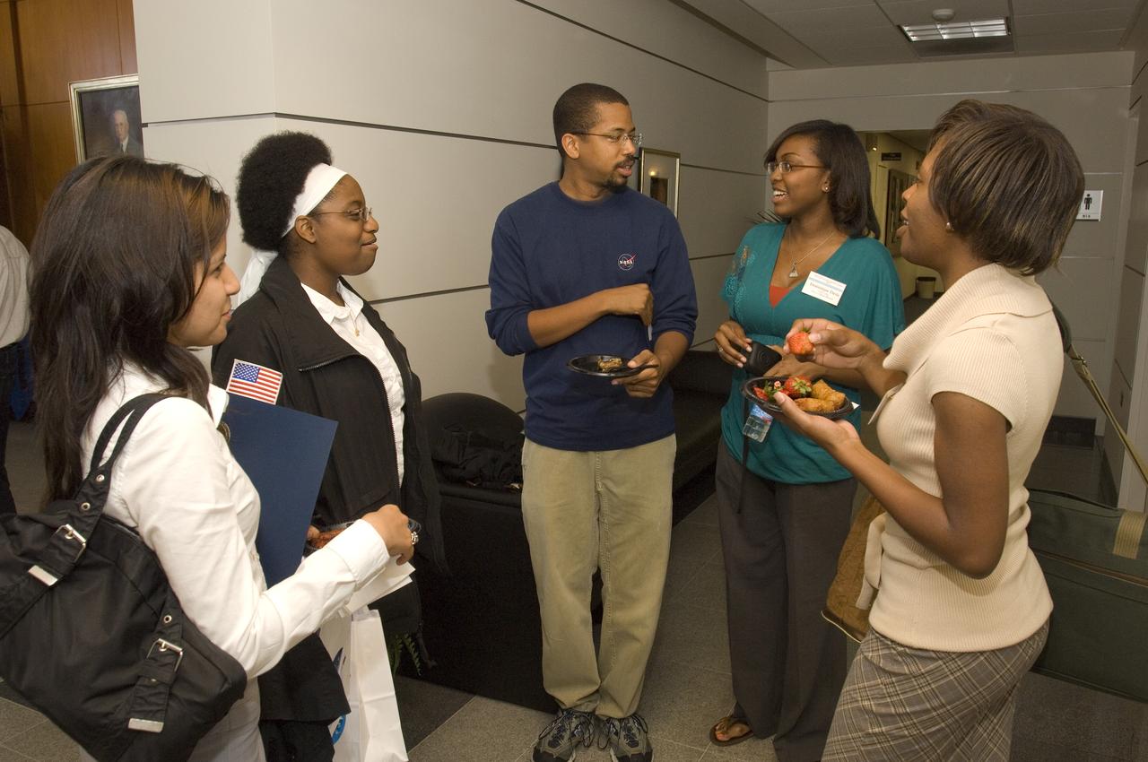 Summer Internship for 2008 closing ceremony  students enjoying the receptionon in lobby of the Ames Administration building N-200.