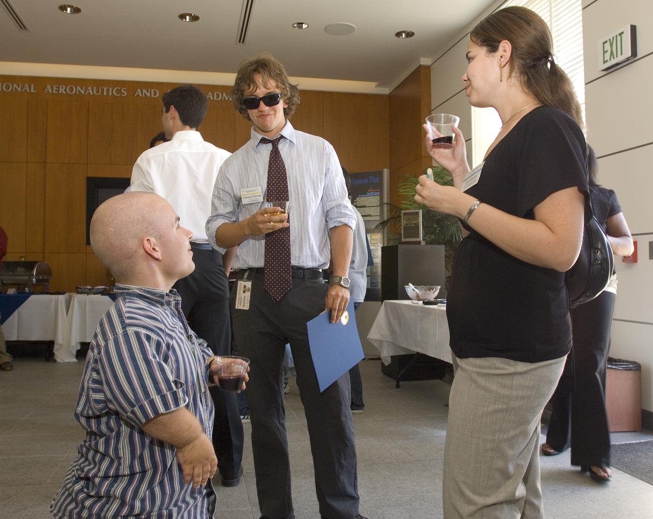 Summer Internship for 2008 closing ceremony  students enjoying the receptionon in lobby of the Ames Administration building N-200.