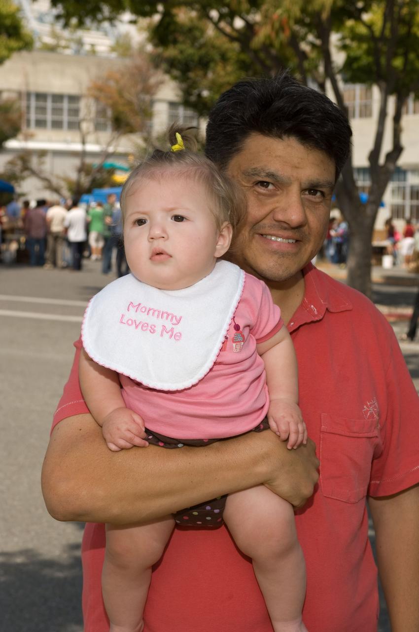 Ames Family Day Picnic in celebration of NASA's 50th Anniversary Cesar Acosta and one of the twins.