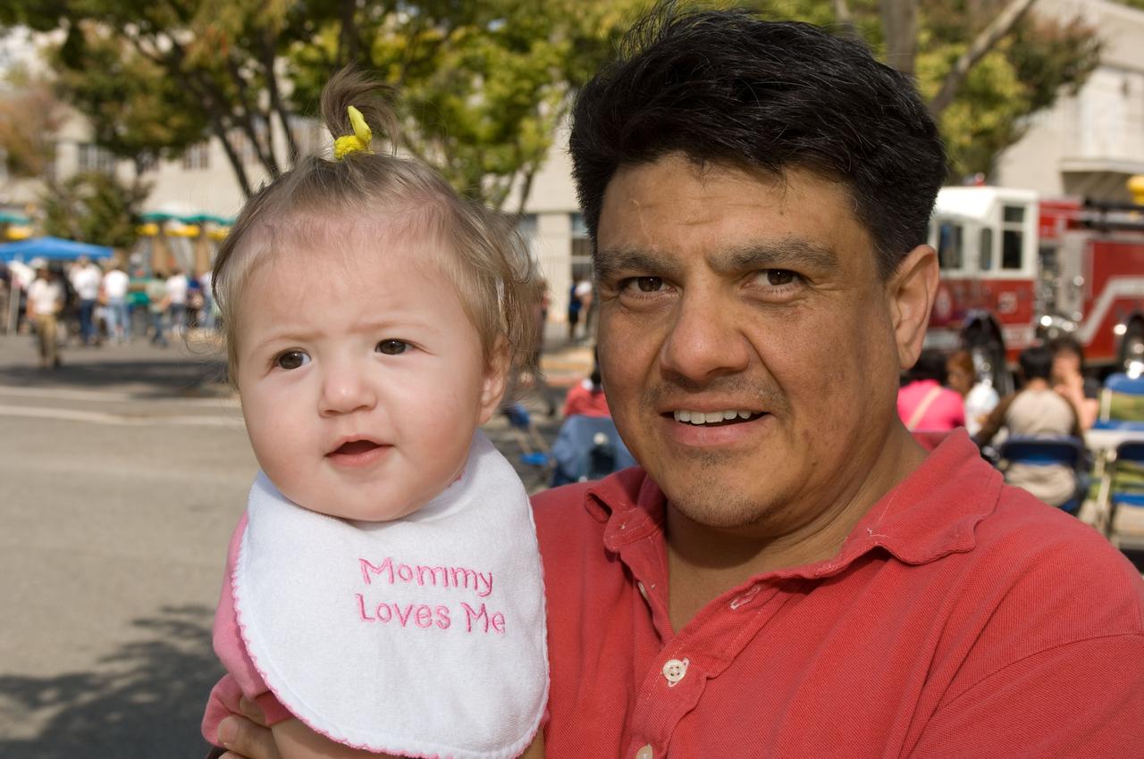 Ames Family Day Picnic in celebration of NASA's 50th Anniversary. Cesar Acosta and one of the twins.