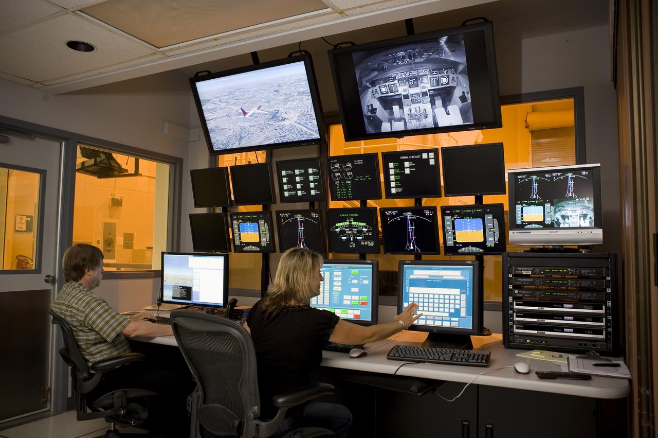 Ames Research Center Bldg N-257 CVSSRF (Crew Vehicle System Research Facility) simulator: Experimenter/Operator Station   Experimenter's station with Diane Carpenter (r) and Jim Gibson (L)