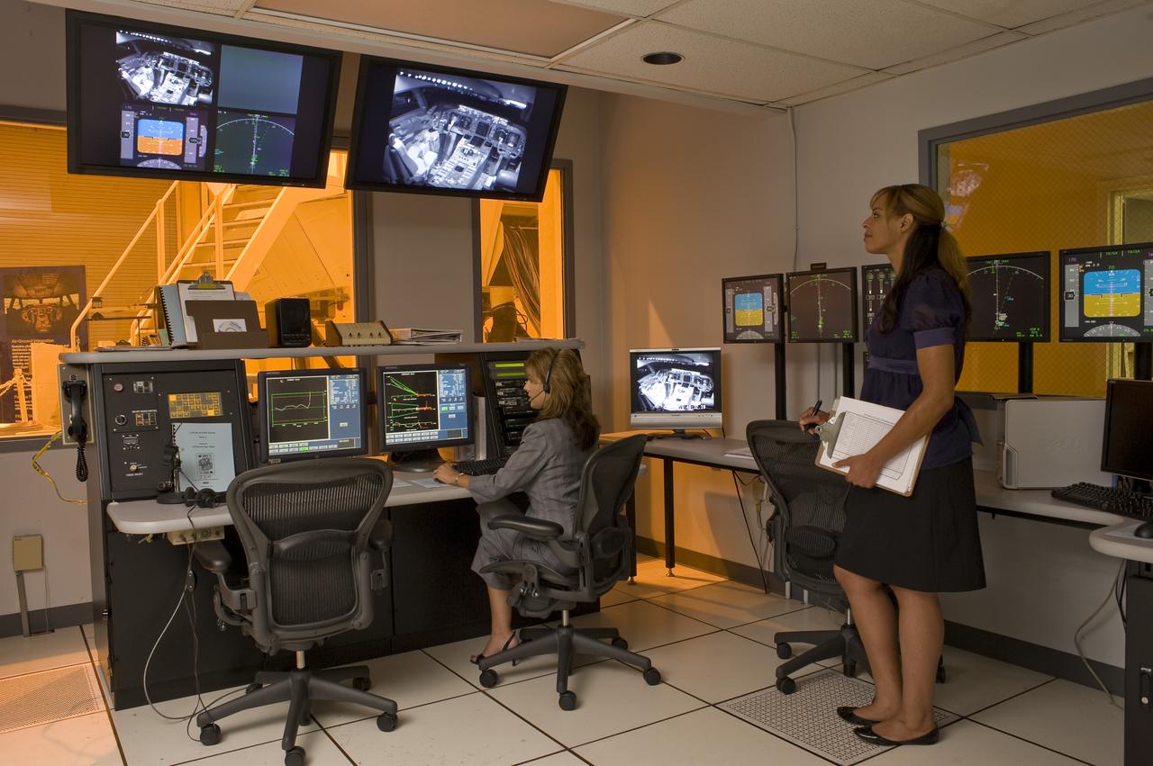 Ames Research Center Bldg N-257 CVSSRF (Crew Vehicle System Research Facility) simulator: Experimenter/Operator Station   Operator's station with Wendy Krikorian and Lisa Grant