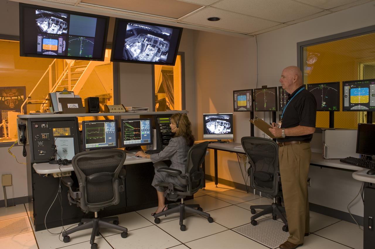 Ames Research Center Bldg N-257 CVSSRF (Crew Vehicle System Research Facility) simulator: Experimenter/Operator Station   Operator's station with Wendy Krikorian and Jim Miller