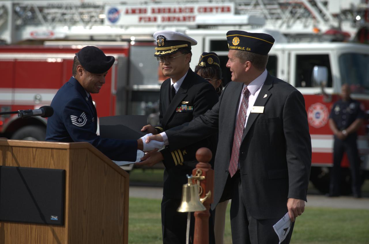 September 11th remembrance ceremony held in front of NASA Research Park Bldg-17 (Lunar Science Institute) hosted by the American Legion, Post 881, Moffett Field. City of Sunnyvale council members - Otto Lee and David Whittum presents Cerificate of Commendation