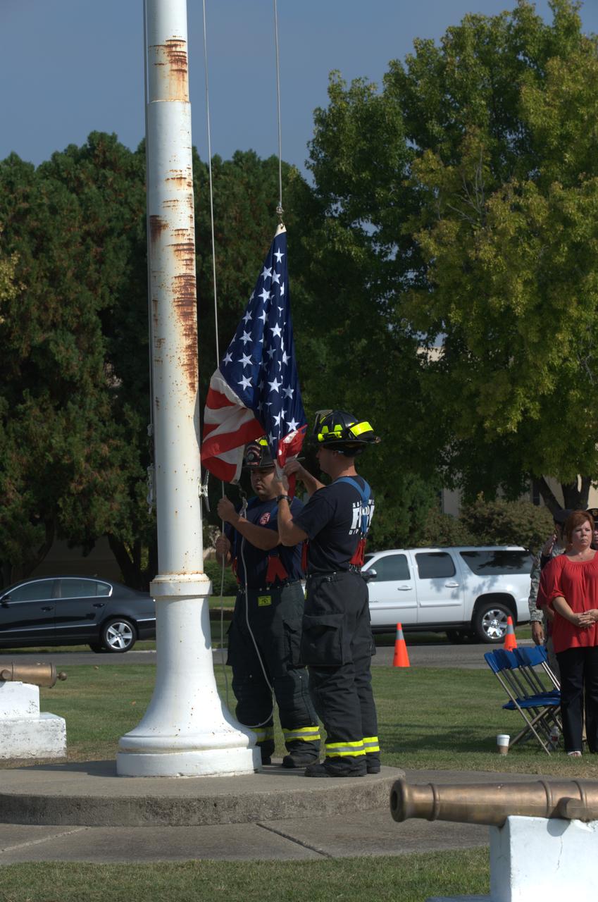 September 11th remembrance ceremony held in front of NASA Research Park Bldg-17 (Lunar Science Institute) hosted by the American Legion, Post 881, Moffett Field.  Flag detail - Lt Randy Vincent - NASA Protective Services, Ty Locatelli,  Carlos Pinedo  - NASA Fire Department