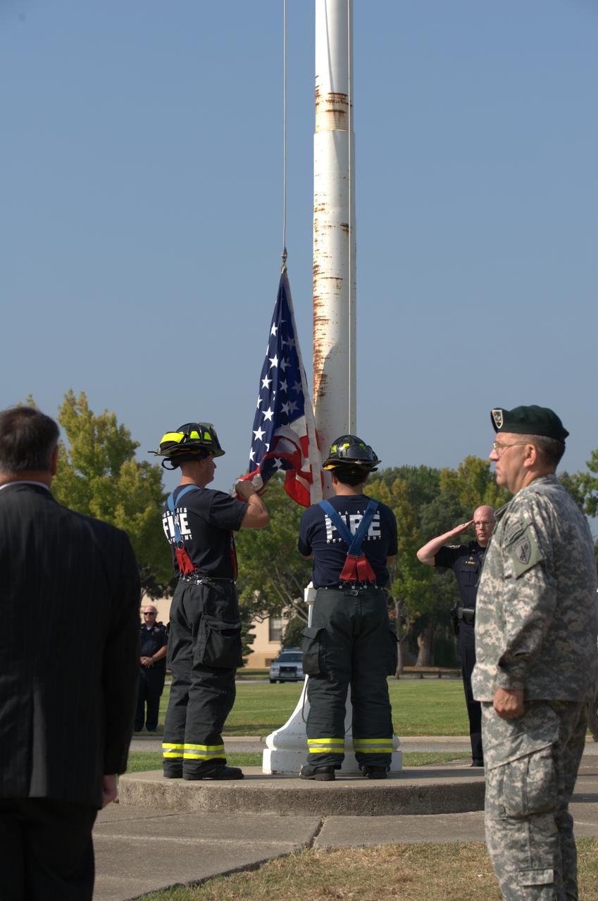 September 11th remembrance ceremony held in front of NASA Research Park Bldg-17 (Lunar Science Institute) hosted by the American Legion, Post 881, Moffett Field.  Flag detail - Lt Randy Vincent - NASA Protective Services, Ty Locatelli,  Carlos Pinedo  - NASA Fire Department