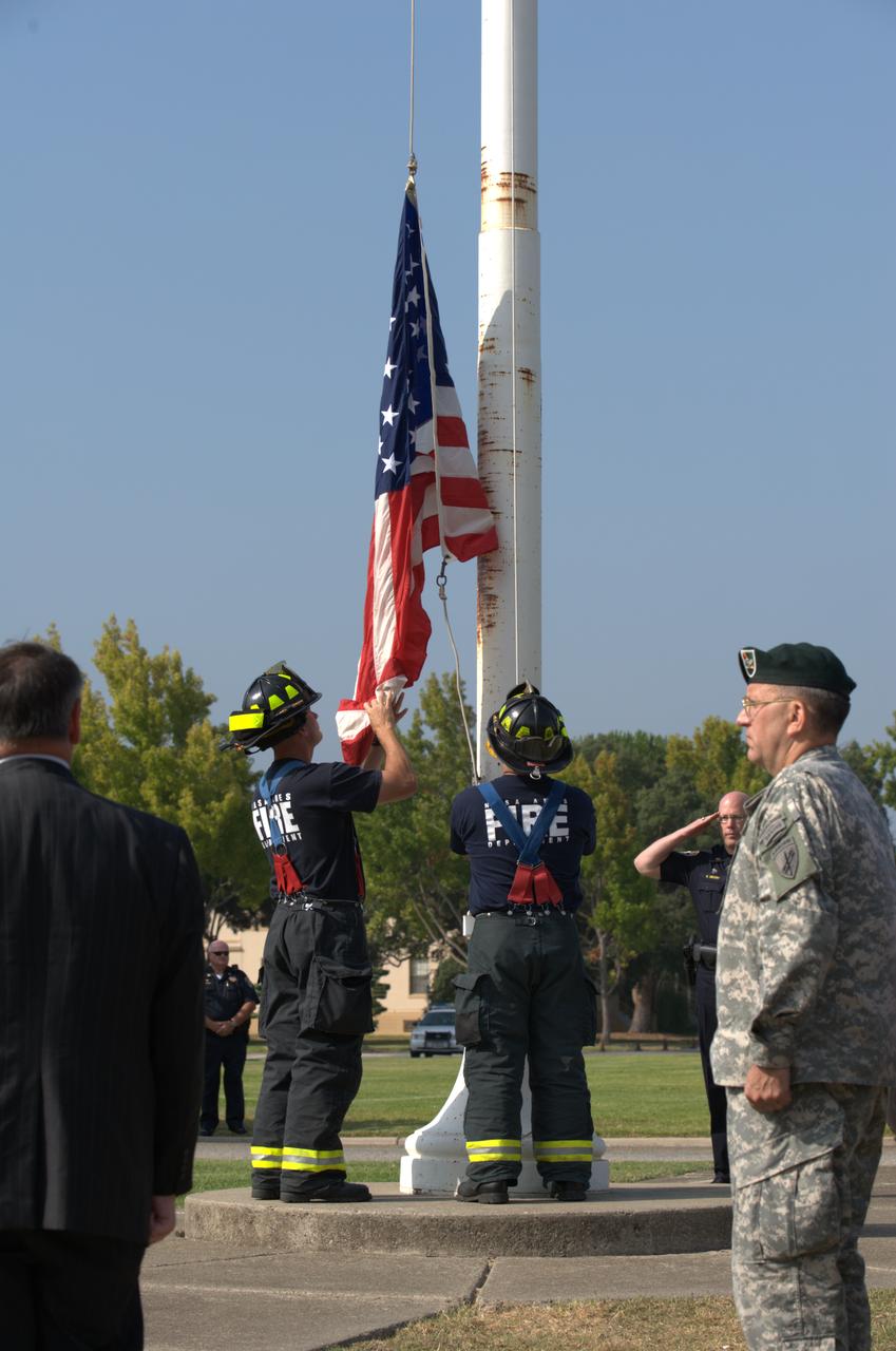 September 11th remembrance ceremony held in front of NASA Research Park Bldg-17 (Lunar Science Institute) hosted by the American Legion, Post 881, Moffett Field.  Flag detail - Lt Randy Vincent - NASA Protective Services, Ty Locatelli,  Carlos Pinedo  - NASA Fire Department