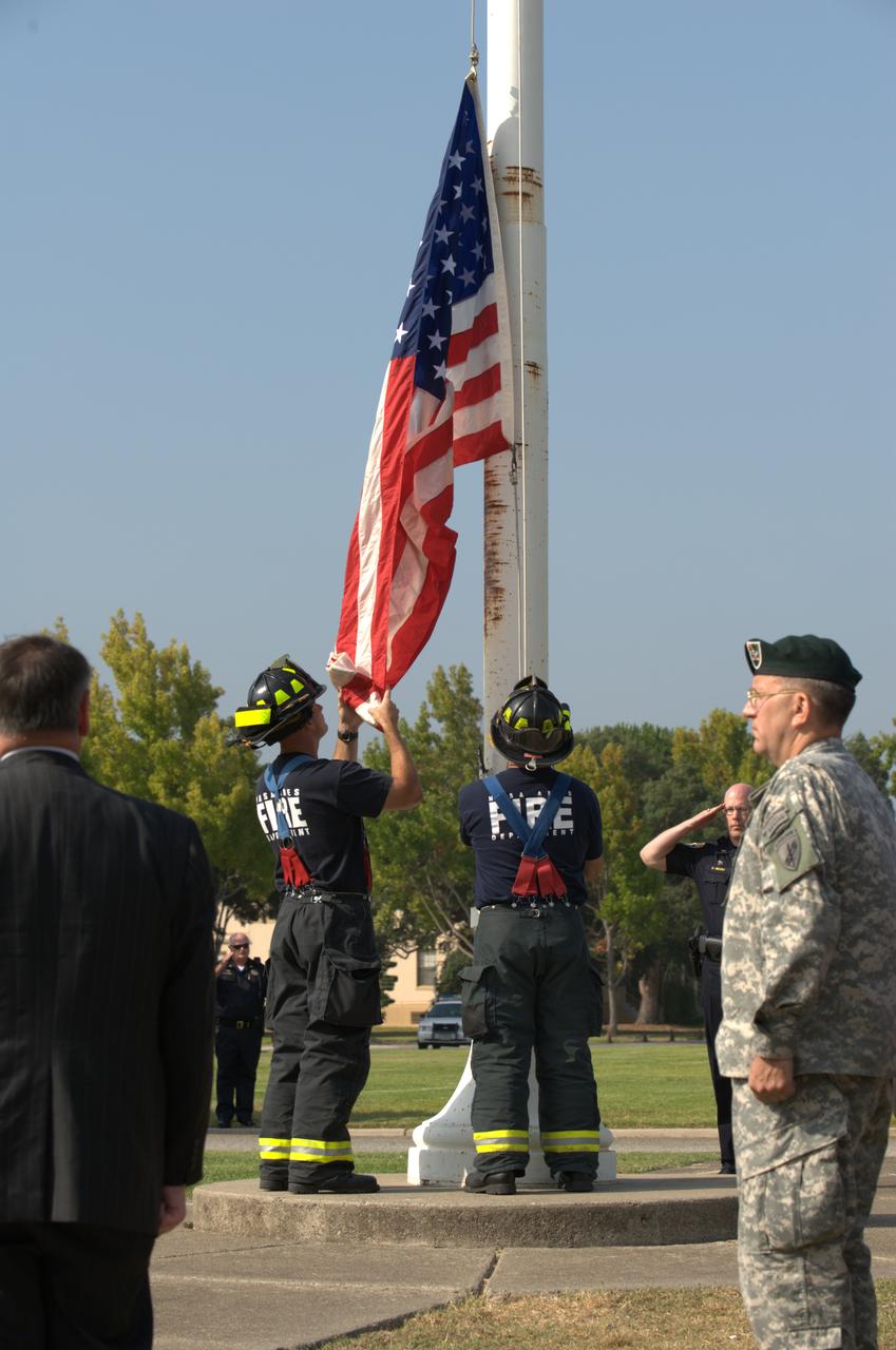 September 11th remembrance ceremony held in front of NASA Research Park Bldg-17 (Lunar Science Institute) hosted by the American Legion, Post 881, Moffett Field.  Flag detail - Lt Randy Vincent - NASA Protective Services, Ty Locatelli,  Carlos Pinedo  - NASA Fire Department