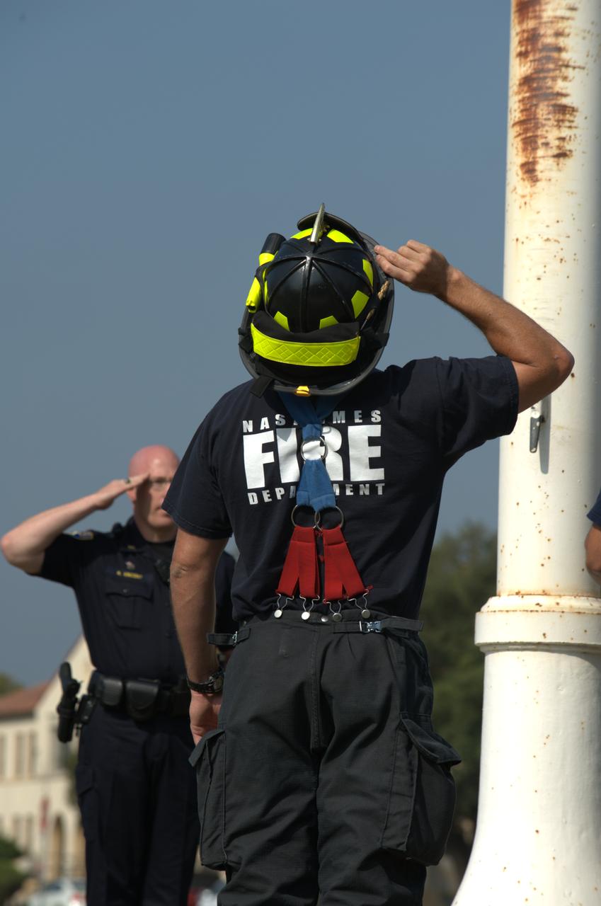 September 11th remembrance ceremony held in front of NASA Research Park Bldg-17 (Lunar Science Institute) hosted by the American Legion, Post 881, Moffett Field.  Flag detail - Lt Randy Vincent - NASA Protective Services, Ty Locatelli,  Carlos Pinedo  - NASA Fire Department