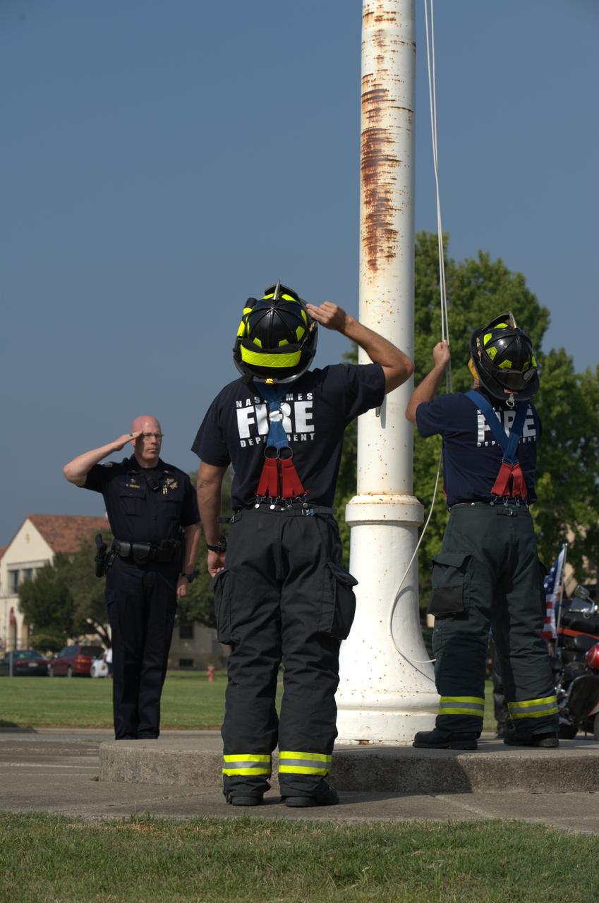 September 11th remembrance ceremony held in front of NASA Research Park Bldg-17 (Lunar Science Institute) hosted by the American Legion, Post 881, Moffett Field.  Flag detail - Lt Randy Vincent - NASA Protective Services, Ty Locatelli,  Carlos Pinedo  - NASA Fire Department